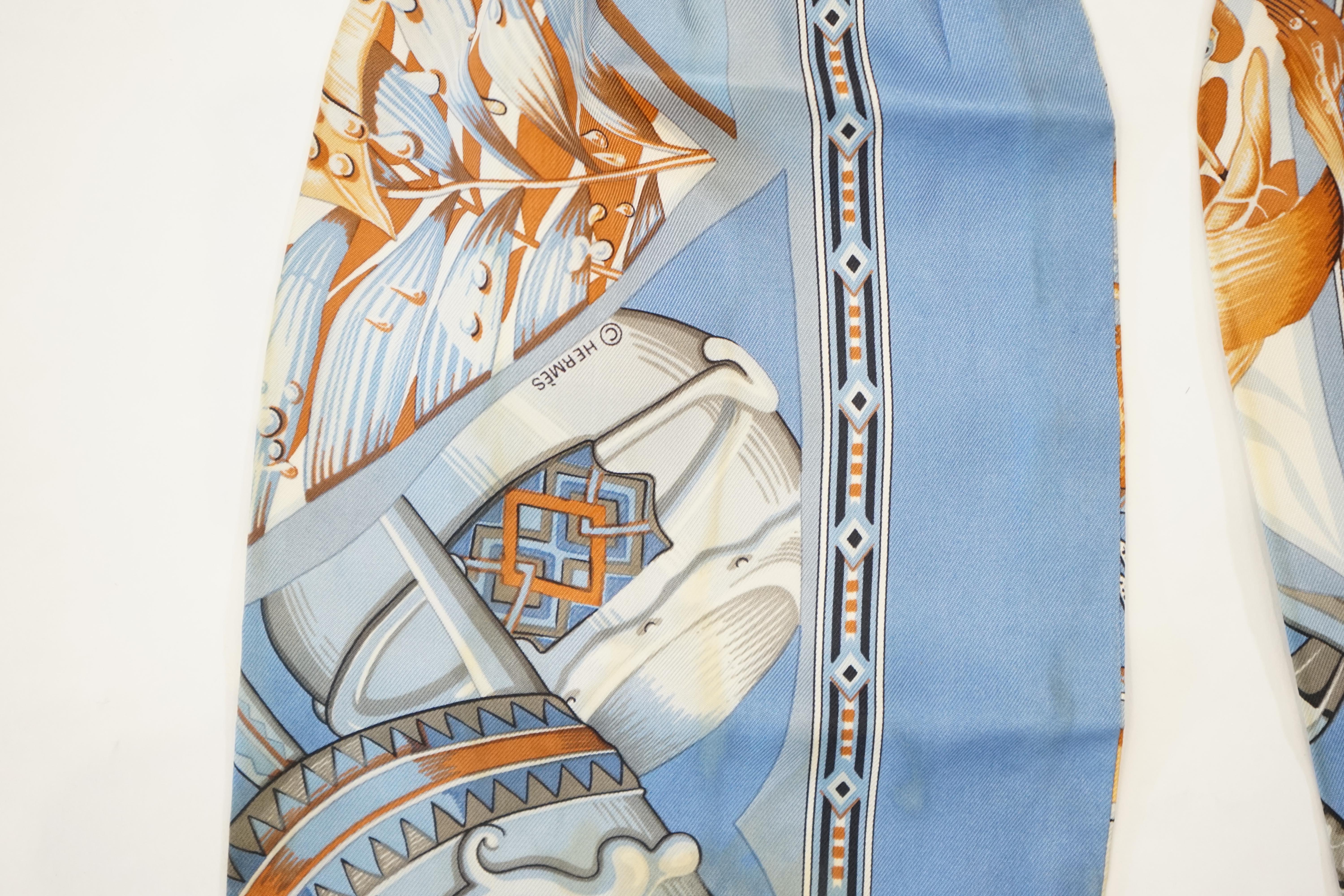 A Hermès silk cravat in ethnographic pattern, length 127cm x 18cm